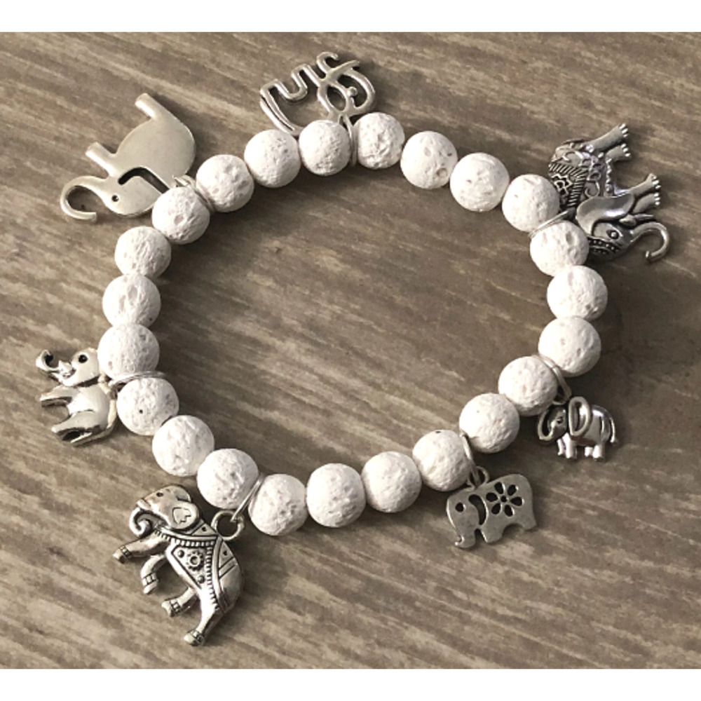 Charm bracelet with turtles and white lava beads